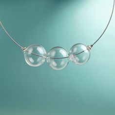 "This Clear glass ball necklace is made of glass in the lampwork technique, each bead is hand blown and unique. This bold chunky necklace is lightweight, stylish and elegant and will become a versatile and irreplaceable addition to your everyday outfits! 💕 You will definitely look stunning in this glass bubble necklace! Dimensions: the necklace length is not adjustable and is 17 3/4\" inch (45 cm). Materials: artist lampwork glass beads, metal fittings. 🎁 This big bead necklace will also be a Modern Handmade Clear Necklaces, Clear Glass Necklace For Jewelry Making, Clear Glass Necklaces For Jewelry Making, Clear Glass Beaded Necklaces, Clear Glass Round Bead Necklaces, Clear Glass Round Beads Necklaces, Clear Glass Necklaces With Round Beads, Modern Glass Necklaces With Round Beads, Modern Glass Round Bead Necklaces