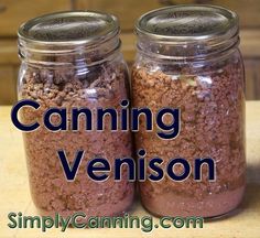 two jars filled with food sitting on top of a wooden table next to each other