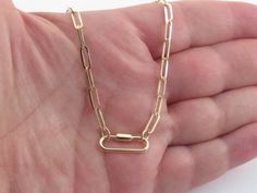 Fabulous 14k Yellow Gold Classic Papaerclip Carabiner Necklace Material: Real 14k gold , Not plated Length: 18" long  Width of the links: 3.4 mm wide  Length of the links: 9.7 mm long  Necklace weight: 3.9 grams  Carabiner size: 3/4" long by 1/4" wide Carabiner clasp: Screw opens on top Gift Box included Images may be enlarges to show details.Please pay attention to the photos and read description before the purchase. I ask you earnestly to make sure about measurements such as size , thickness, and length. Should you have any concerns or questions I'll be happy to help you out. I usually respond within a short time. All measurements are approximate.All jewelry is tested for purity and none are plated or filled.Please purchase with confidence. *Free shipping for USA through USPS.I usually s Carabiner Necklace, Top Gifts, New Yorker, Paper Clip, Long Necklace, Chains Necklace, Favorite Jewelry, Screw, Accessory Gift