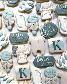 baby shower cookies are arranged on a table