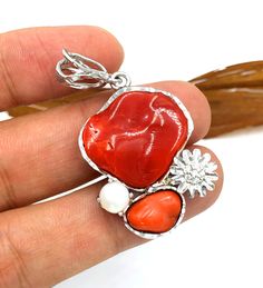 Mediterranean Red Coral Pendant, Coral with Natural Freshwater Pearl, Sterling Silver 925, Jewellry Pendant,Coral Necklace, Handmade Pendant Material: Mediterranean red coral , Natural Freshwater Pearl, Silver 925 Best Suitable for pedant and necklace. Total Size : 37*26 mm Origin : Mediterranean sae  Pendant weight : 47.85 CT Red Coral gemstone imparts courage and helps in overcoming fear and nervousness in the individual. This is the best gemstone, which can boost the self-esteem of the wearer Handmade Silver Jewelry With Red Coral, Red Sterling Silver Jewelry With Natural Stones, Handmade Coral Sterling Silver Jewelry, Red Sterling Silver Fusion Jewelry, Artisan Red Sterling Silver Jewelry, Handmade Fusion Red Jewelry, Handmade Red Fusion Jewelry, Red Fusion Style Pendant Jewelry, Coral Gemstone