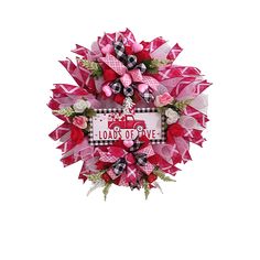 a pink and black wreath that says load of love