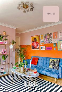 Image of a room painted in half pink (bubble gum pink from Lick Pink 03) and half orange. There is a blue sofa and lots of colourful furnishings. The next image is a Lick Pink 03 can. Colourful Living Room Decor, Retro Home, Modern Interior Design, Home Decor Inspiration, Colorful Interiors, House Colors, Home Deco