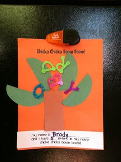 an orange piece of paper with the words brony written on it and a tree made out of letters