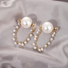 Gorgeous Glossy White Pearl Earring in Gold Color. Wear every day or an event. Party Pearl Chain Round Earrings, Pearl Chain Earrings For Party, Round Pearl Chain Earrings For Party, Trendy Pearl Earrings For Party, Party Drop Earrings With Pearl Chain, White Pearl Earring, Pearl Earring, Pearl Chain, Glossy White