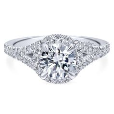 a diamond engagement ring with two rows of diamonds around it