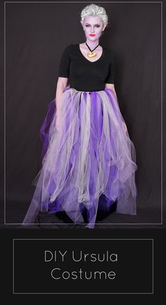 a woman with white hair wearing a purple tulle skirt and black t - shirt