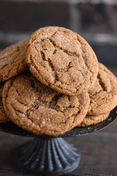 a pile of cookies sitting on top of a black plate