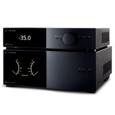 two black stereos sitting side by side on top of each other in front of a white background