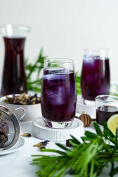 Two Glasses And One Pitcher Of Butterfly Pea Tea or Blue Tea