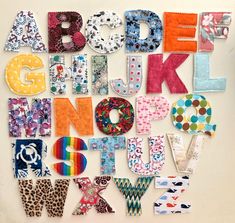 the letters are made up of different fabrics