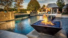 a fire pit sitting in the middle of a pool