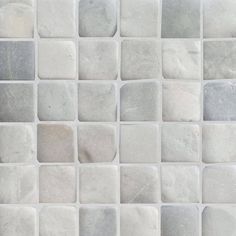 white and grey tile with small squares on it