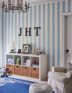 a blue and white striped wall in a child's room