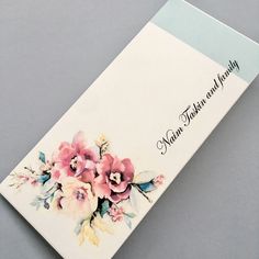 a close up of a card with flowers on it