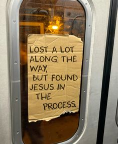 a sign posted on the side of a train door that says lost a lot along the way, but found jesus in the process