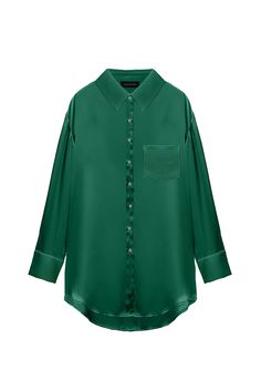 An elegant oversized button-up blouse made from satin viscose in a rich emerald shade. Perfect to dress up or down, this style features dropped shoulder seams, back pleats for added shape, and an extended shirttail hem. The Kaia Blouse is cut for an oversized fit. Take your true size, or size down if a closer fit is preferred. Material & Care 52% Recycled rayon; 48% Viscose Dry Clean Only Fit & Details The Kaia Blouse is cut for an oversized fit. Take your true size, or size down if a closer fit Green Silk Button-up Blouse, Green Silk Formal Shirt, Formal Green Silk Shirt, Chic Oversized Green Blouse, Chic Green Formal Shirt, Green Satin Top For Work, Green Satin Blouse For Evening, Green Satin Top For Workwear, Chic Satin Green Blouse