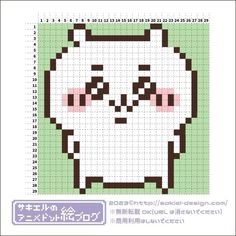 a cross stitch pattern with an image of a cat's face in the center