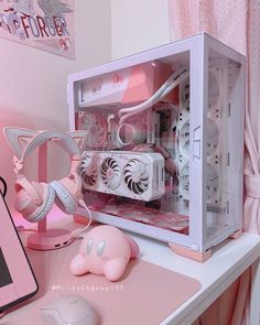 a pink computer case sitting on top of a desk