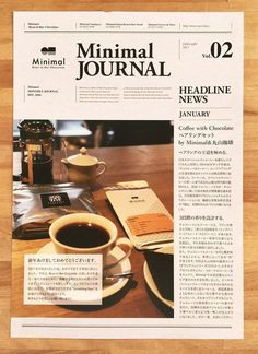 the front page of a newspaper with a cup of coffee next to it on top of a wooden table