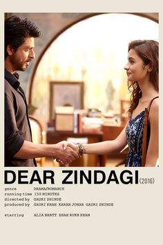 the poster for dear zindagi is being held by a woman in a dress