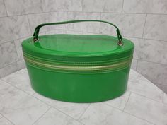 "1960s Bag Lime Green Patent Leather Travel Vanity Makeup Case Train Oval Tote. Nice Mid Century Case or Bag great for many uses. Measures 13\" x 6\" with handle 8\"H Made by Keene, with some wear and spots. A very minor separation on inside bottom. Over all in good condition. Thank You" Travel Vanity, Vanity Makeup, Toiletry Storage, Leather Travel, Makeup Case, Makeup Vanity, Compost Bin, Cosmetic Bags, Lime Green