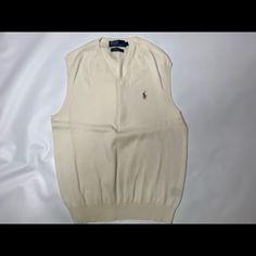 Polo Ralph Lauren Sweater Vest Cream Large. Never Worn Classic Sleeveless Sweater For Spring, Classic White Sleeveless Sweater Vest, Classic Sleeveless Spring Sweater, Classic Cream Tops For Winter, Cream Fitted Sweater Vest For Winter, Fitted Cream Sweater Vest For Winter, Classic White Vest For Fall, Classic Cotton Crew Neck Sweater Vest, White Crew Neck Vest For Fall