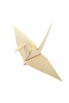 an origami bird is flying in the air