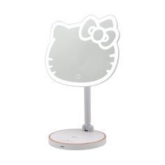 a white hello kitty mirror on top of a stand