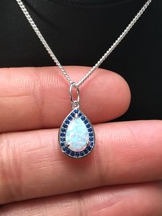 White Fire Opal and Blue Sapphire Pendant Necklace Metal: .925 Sterling Silver Stone: Lab created Opal and Blue Sapphire CZ Measurement: pendant height is approx. 15mm Choose Chain Length Please feel free to Convo me with any questions before purchasing. Please view policy before purchasing Other Opal Necklaces can be found here https://www.etsy.com/shop/LinksAndStones?ref=ss_profile&section_id=24284450 Thank You For Visiting My Shop Opal Necklaces, Sapphire Pendant Necklace, Blue Sapphire Pendant, Sapphire Necklace Pendants, Blue Sapphire Necklace, Fire Opal Necklace, Necklace Bridal, Sapphire Pendant, Necklace Blue