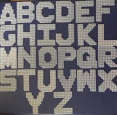 the letters and numbers are made out of perforated paper