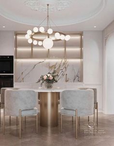 an elegant dining room with marble and gold accents