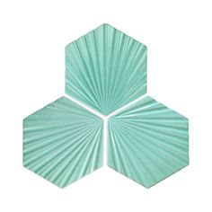 three hexagonal shapes made out of green and white paper on a white background