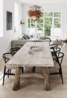 a wooden table sitting in the middle of a living room