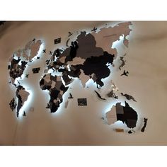 the world map is made up of many different types of paper cutouts and lights