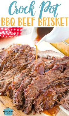 the crock pot bbq beef brisket is being drizzled with barbecue sauce