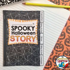 a halloween story book sitting on top of notebooks