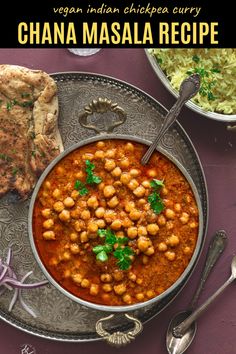 a bowl of chickpea curry next to some rice and pita bread on a plate