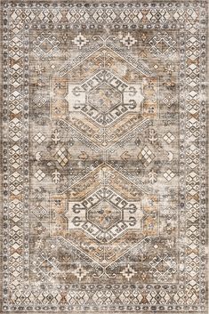 a beige and brown rug with an intricate design