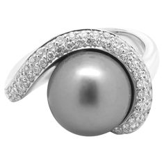 Material: 14K white gold Pearl: 1 11.25MM Tahitian pearl Diamonds: 53 round cut = .53cttw Color: H Clarity: SI1 Ring Size: 7 (please allow two additional shipping days for sizing requests) Dimensions: ring measures 15.5mm wide Weight: 12.03 grams Diamond Bracelet Design, Pearl And Diamond Ring, Modern Ring, Tahitian Pearls, Pearl Diamond, Gold Pearl, Tahiti, Ring Size 7, Modern Jewelry