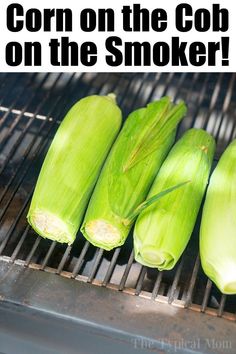 corn on the cob on the grill with text that reads corn on the cob on the smoker