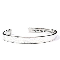 "* Personalize the inside with a custom message - up to 30 characters included * Hand crafted from 925 sterling silver * Bracelet measures 6mm wide * Hand stamped & unique; not machine engraved * Hammered texture finish outside * Packaged and ready to gift *This listing includes one (1) cuff bracelet in your choice of metal. Sample photos may show multiples. ✦ ✧ EXTRAS + ADD-ONS ✧  Want to add more text to the inside? Please contact us for a custom quote. ✧ CUFF SIZING ✧ All LSJ cuff bracelets are slightly adjustable, and we recommend the AVERAGE size band for gifting or when the size is unknown.  ⬩ XS  - Fits wrists 4\"-5.5\" ⬩ SMALL - Fits wrists 4.5\"-6.5\" ⬩ AVERAGE - Fits wrists 5.5\"-7\" ⬩ LARGE - Fits wrists 6.5\"-8\" Please note: cuffs can be resized smaller for a fee. We are unabl Personalized Adjustable Sterling Silver Bracelet, Inspirational Adjustable Jewelry With Engraving Option, Adjustable Engraved Meaningful Bracelet, Adjustable Engraved Meaningful Bracelets, Customizable Silver Wristband For Friendship, Custom Text Silver Bracelets For Anniversary, Custom Text Silver Bracelet For Anniversary, Silver Bracelet With Custom Text For Anniversary, Meaningful Engraved Adjustable Bracelet