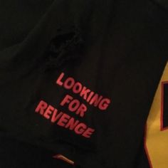 a black jacket with the words looking for revegege written in red on it