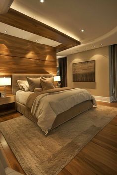 a large bed sitting inside of a bedroom on top of a hard wood flooring