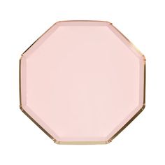 a pink plate with gold trim on the edge and an octagonal shape in the middle