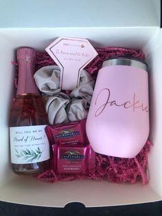 a pink wine gift box with personalized items