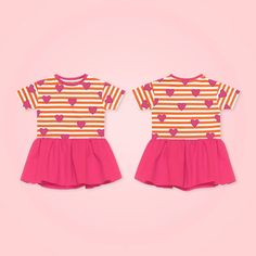 two children's dresses with hearts on them, one is pink and the other is orange