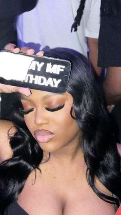 a woman is holding her phone up to her face with the words my me birthday on it