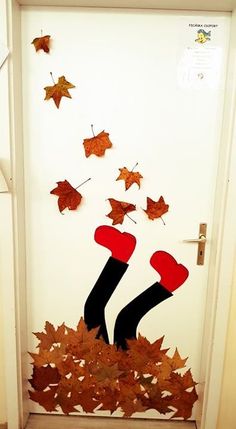 the door is decorated with leaves and stockings