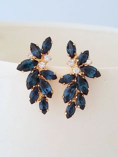 "Navy blue earrings,Blue bridal earrings,Statement stud earrings,Large earring,Cluster earring,European earring,crystal earring,Bridesmaids earrings Amazing, breathtaking earrings -high fashion inspired. Measurments: 32 mm x 17 mm at the widest points (1.25 x 0.67 inches) They are made of 14k gold plated studs and Swarovski crystals, all set in prong setting. Made with CRYSTALLIZED™ - High quality genuine European (Austrian) crystals. AVAILABLE ALSO IN SILVER PALTE VERSION. JUST CHOOSE AT \"META Navy Blue Jewelry, Blue Bridal Earrings, Navy Blue Earrings, Bridal Earrings Studs, Bridal Statement Earrings, Earrings Sapphire, Blue Bridal, Wedding Jewelry Earrings, Swarovski Earrings